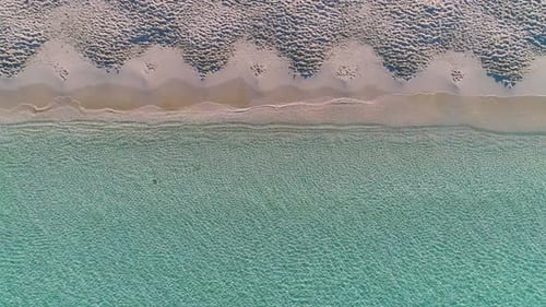 Transparent sea water near stony remote coast