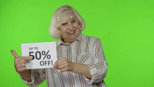 Smiling Woman Holding 50 Percent Off Sign