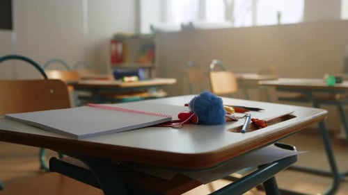 Empty School Classroom With Desks and Chairs