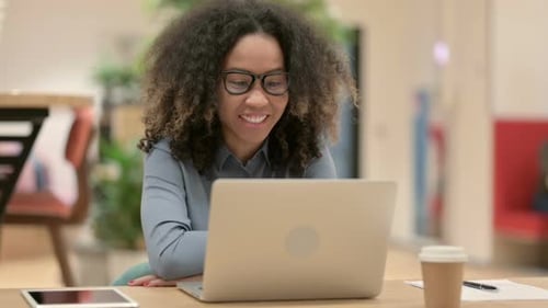 Woman On Video Call Smiling and Waving