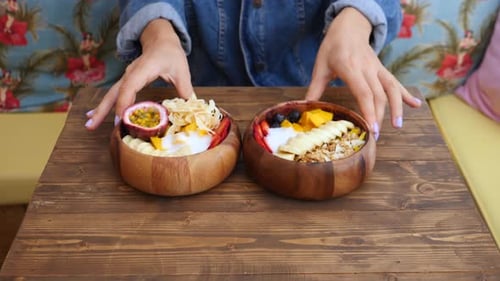 Two Fruit and Yogurt Breakfast Bowls on Table