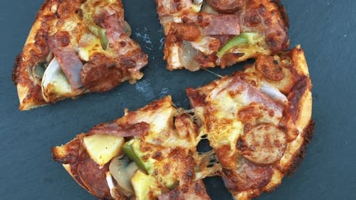 Delicious Pizza with Sausage, Ham, and Pineapple