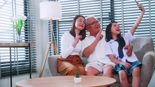 Family Taking Selfie on Couch