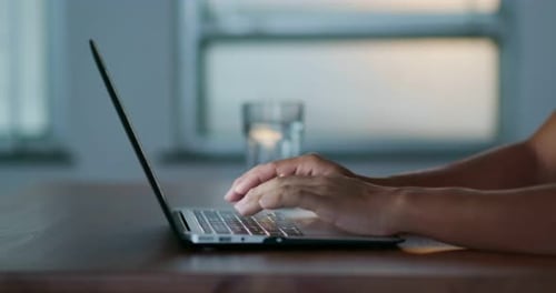 Adult Typing on Modern Laptop Computer
