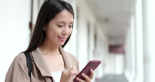 Young Woman Using Smartphone Outdoors
