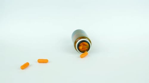 Pill Bottle on White Surface