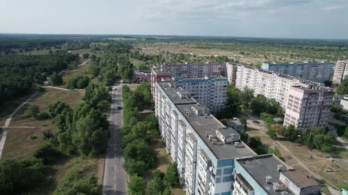 Aerial View MultiStorey Buildings Near Green Forest in Residential Area at City