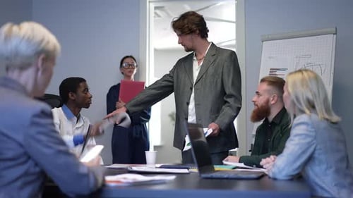 Portrait of Angry Boss Firing Unproductive Manager at Business Meeting in Office