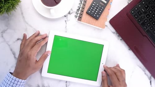 Flat Composition of Young Man Suing Digital Tablet on Office Desk