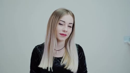 Woman with Blonde Hair Smiling in Close Up