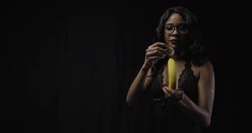 Sensual Woman Practices Safe Sex with Banana