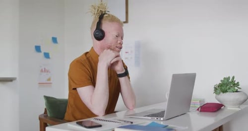Young Adult on Video Call in Home Office