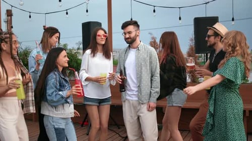 Friends Dancing at Rooftop Party Celebration