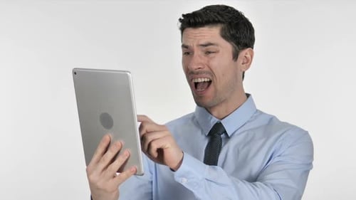 Man Reacts Negatively to Tablet on White Background