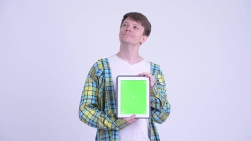 Man Holding Tablet with Green Screen Mockup