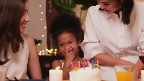 Females Celebrate Birthday with Cake Indoors