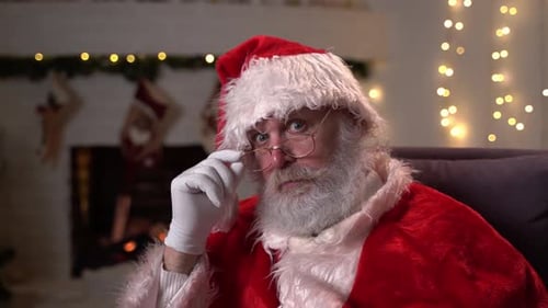 Senior Man in Santa Suit Asks for Silence