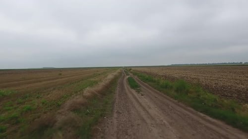 Driving Bicycle On A Dirt Road