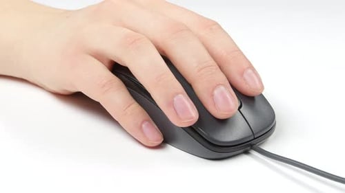 Hand Clicking Wired Mouse on White Surface