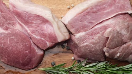 Close Up of Red Meat on Chopping Board