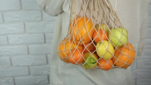 Cítricos orgánicos en bolsa orgánica