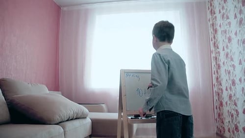 Schoolboy Wrote Numbers on Easel