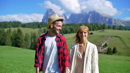 Happy Couple Holding Hands Walking in Nature