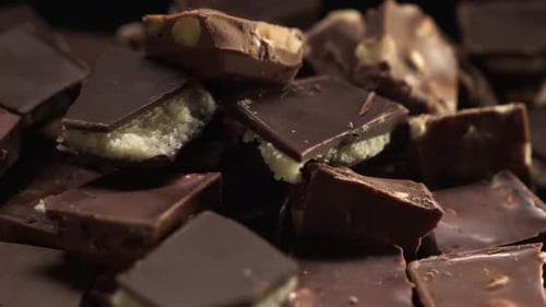 Rotating Pile of Assorted Chocolate Pieces Close Up