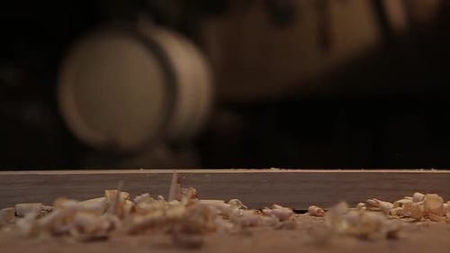 Craftsman smoothing wood with a hand plane