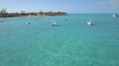 Aerial drone view of a fishing motor boat in the Bahamas, Caribbean.