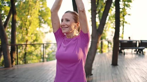 Active Senior Women Doing Yoga in Park