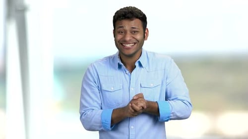 Smiling Man Gesturing Positively