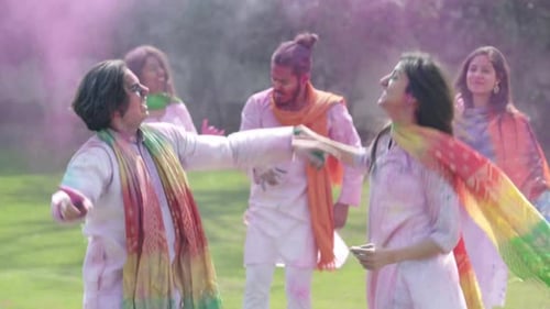 Indian couple dancing at Holi party