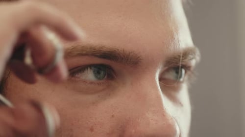 Close-up of Man Receiving Eyebrow Haircut