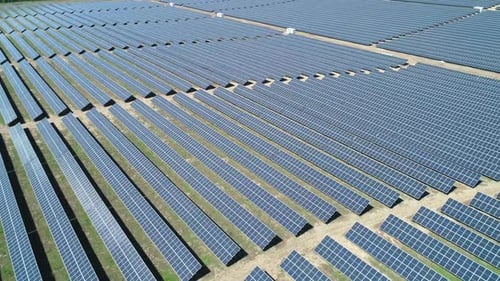 Aerial View of Solar Power Station Field at Sunny Day. Aerial Top View of Solar Farm. Renewable