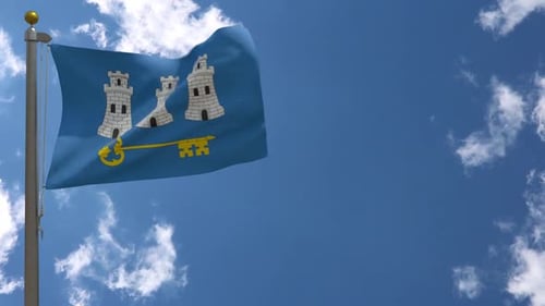 Waving City Flag with Towers and Key Against Blue Sky