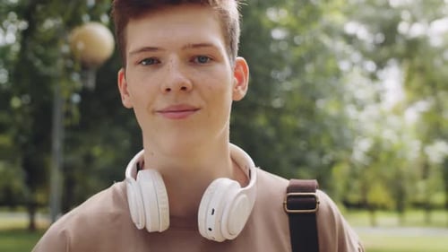 Portrait of Young Male Student in Park