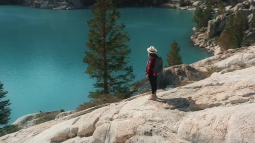 Woman Enjoying Mountain Lake