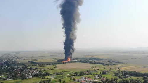 Aerial View of Huge Fire View From Quadcopter. Black Smoke Rises High Into the Sky. Fire on the