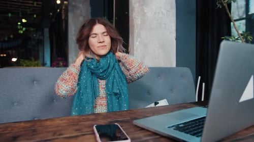 Happy Blogger Girl Talking on Laptop Sitting in Cafe