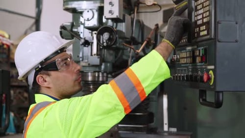 Smart Factory Worker Using Machine in Factory Workshop