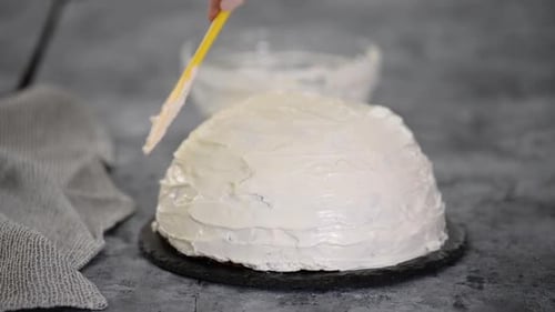 Close Up of Woman Preparing Cake with Vanilla Cream at Home. Making Pancho Cake with Sour Cream.