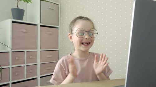 Excited Girl Celebrates Online Learning Success