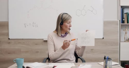 Woman Explaining Chemistry in Online Class