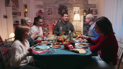 Family Celebrates Christmas Dinner at Home