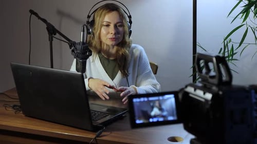 Woman Recording Herself for Live Broadcast or Podcast