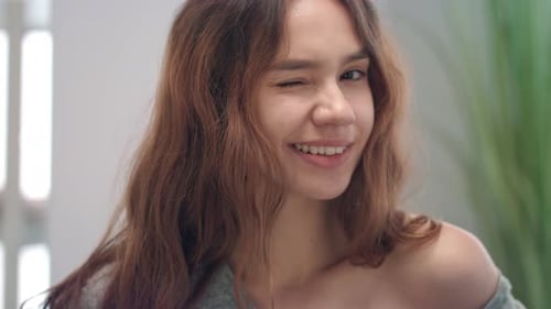 Close Up of a Smiling Woman with Brown Hair