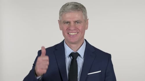 Man in Suit Gives Thumbs Up Sign