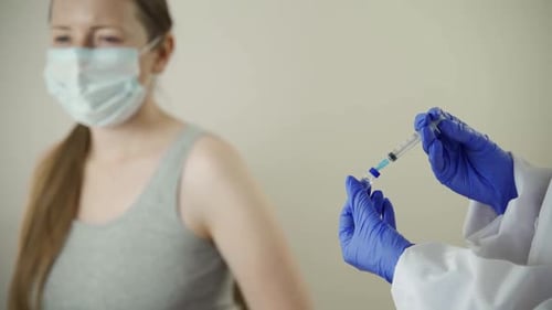 Medical Professional Giving Woman an Injection