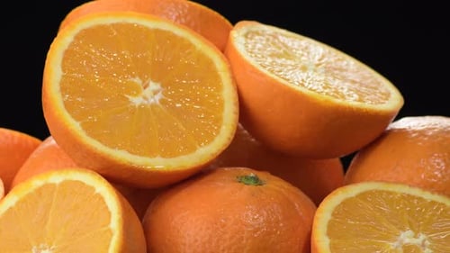 Mountain of Fresh Oranges Cut Gyrating
